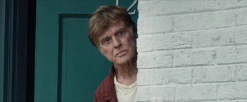 Movie still from “A Walk in the Woods” (2015), directed by Ken Kwapis – An older man standing next to a brick wall; Close Up shot, Low angle