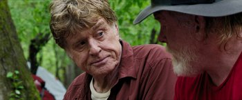 Movie still from “A Walk in the Woods” (2015), directed by Ken Kwapis – An older man in a cowboy hat is looking at another older man; Close Up shot, Over the shoulder angle