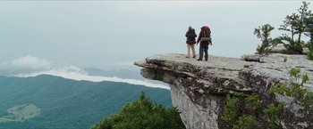 Movie still from “A Walk in the Woods” (2015), directed by Ken Kwapis – A couple of people standing on top of a cliff; Extreme Wide shot, Low angle