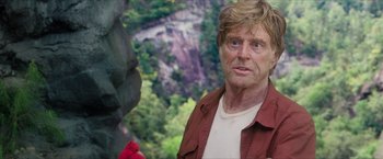 Movie still from “A Walk in the Woods” (2015), directed by Ken Kwapis – A man in a red shirt is looking into the camera; Close Up shot, Over the shoulder angle