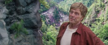 Movie still from “A Walk in the Woods” (2015), directed by Ken Kwapis – An older man standing in front of a cliff; Close Up shot, Over the shoulder angle