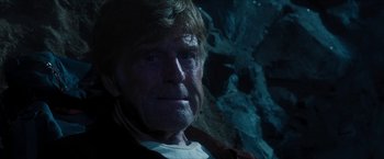 Movie still from “A Walk in the Woods” (2015), directed by Ken Kwapis – An old man with a beard and a white shirt is in a cave; Close Up shot, Low angle
