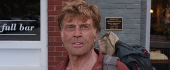Movie still from “A Walk in the Woods” (2015), directed by Ken Kwapis – An older man wearing a red shirt and a backpack; Close Up shot, Low angle