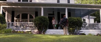 Movie still from “A Walk in the Woods” (2015), directed by Ken Kwapis – A man and a woman standing in front of a house; Wide shot, Over the shoulder angle