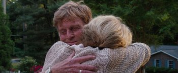 Movie still from “A Walk in the Woods” (2015), directed by Ken Kwapis – An older man hugging a younger woman in a wooded area; Close Up shot, Low angle