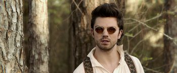 Movie still from “Abraham Lincoln: Vampire Hunter” (2012), directed by Timur Bekmambetov – A man with a beard and sunglasses in the woods; Close Up shot, Over the shoulder angle