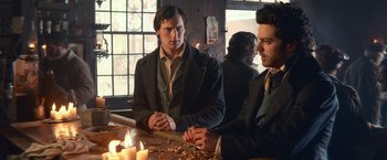 Movie still from “Abraham Lincoln: Vampire Hunter” (2012), directed by Timur Bekmambetov – Two men sitting at a table in front of candles; Medium shot, Over the shoulder angle