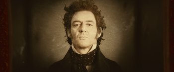 Movie still from “Abraham Lincoln: Vampire Hunter” (2012), directed by Timur Bekmambetov – An old photo of a man in a black suit; Close Up shot, High angle