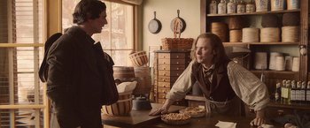 Movie still from “Abraham Lincoln: Vampire Hunter” (2012), directed by Timur Bekmambetov – Two people in a room with a pie on the counter; Medium shot, Over the shoulder angle
