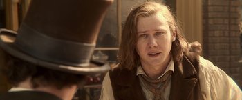 Movie still from “Abraham Lincoln: Vampire Hunter” (2012), directed by Timur Bekmambetov – A man with long brown hair and a brown vest is crying; Close Up shot, Over the shoulder angle