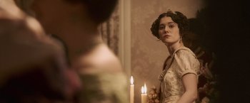 Movie still from “Abraham Lincoln: Vampire Hunter” (2012), directed by Timur Bekmambetov – A woman standing in front of a bathroom mirror; Close Up shot, Over the shoulder angle