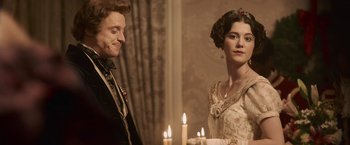 Movie still from “Abraham Lincoln: Vampire Hunter” (2012), directed by Timur Bekmambetov – A man and a woman standing in front of lit candles; Close Up shot, Over the shoulder angle