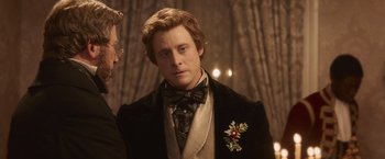 Movie still from “Abraham Lincoln: Vampire Hunter” (2012), directed by Timur Bekmambetov – A man wearing a suit and a bow tie; Close Up shot, Over the shoulder angle