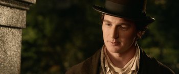 Movie still from “Abraham Lincoln: Vampire Hunter” (2012), directed by Timur Bekmambetov – A man wearing a top hat and holding his eyes closed; Close Up shot, Over the shoulder angle