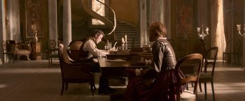 Movie still from “Abraham Lincoln: Vampire Hunter” (2012), directed by Timur Bekmambetov – A man and a woman sitting at a table with papers; Wide shot, High angle