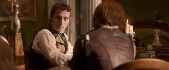 Movie still from “Abraham Lincoln: Vampire Hunter” (2012), directed by Timur Bekmambetov – A man sitting in front of a woman in front of a mirror; Medium shot, Over the shoulder angle