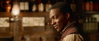 Movie still from “Abraham Lincoln: Vampire Hunter” (2012), directed by Timur Bekmambetov – A person smiling at the camera; Close Up shot, Over the shoulder angle