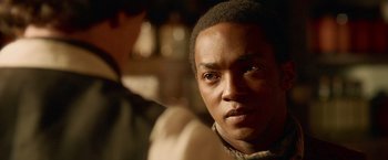 Movie still from “Abraham Lincoln: Vampire Hunter” (2012), directed by Timur Bekmambetov – A man's face in a dark room; Close Up shot, Over the shoulder angle