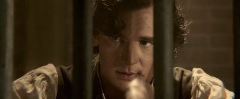 Movie still from “Abraham Lincoln: Vampire Hunter” (2012), directed by Timur Bekmambetov – A person behind a fence; Close Up shot, High angle