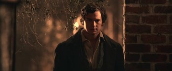 Movie still from “Abraham Lincoln: Vampire Hunter” (2012), directed by Timur Bekmambetov – A man in a brown jacket standing next to a tree; Close Up shot, Over the shoulder angle