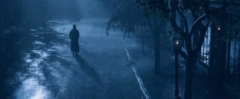 Movie still from “Abraham Lincoln: Vampire Hunter” (2012), directed by Timur Bekmambetov – A man is standing in the middle of a road in the rain; Extreme Wide shot, High angle