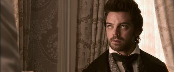 Movie still from “Abraham Lincoln: Vampire Hunter” (2012), directed by Timur Bekmambetov – A person wearing a suit and tie; Close Up shot, Over the shoulder angle