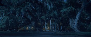 Movie still from “Abraham Lincoln: Vampire Hunter” (2012), directed by Timur Bekmambetov – A very large tree in front of a building; Extreme Wide shot, Low angle