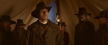 Movie still from “Abraham Lincoln: Vampire Hunter” (2012), directed by Timur Bekmambetov – A man and a woman in a tent with a lit lamp; Medium shot, Low angle