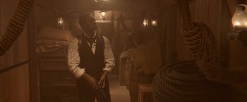 Movie still from “Abraham Lincoln: Vampire Hunter” (2012), directed by Timur Bekmambetov – A man holding a gun while standing in a room; Medium shot, High angle