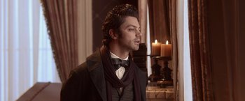 Movie still from “Abraham Lincoln: Vampire Hunter” (2012), directed by Timur Bekmambetov – A man wearing a bow tie and a jacket; Close Up shot, Over the shoulder angle