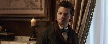 Movie still from “Abraham Lincoln: Vampire Hunter” (2012), directed by Timur Bekmambetov – A man in a suit standing in front of a candle; Close Up shot, Over the shoulder angle