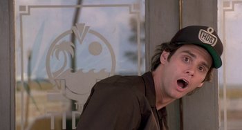 Movie still from “Ace Ventura: Pet Detective” (1994), directed by Tom Shadyac – A man with his mouth wide open looking surprised; Close Up shot, Low angle