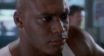 Movie still from “Ace Ventura: Pet Detective” (1994), directed by Tom Shadyac – A person's face with water on his face; Close Up shot, Low angle