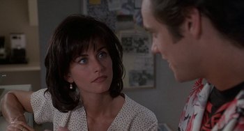 Movie still from “Ace Ventura: Pet Detective” (1994), directed by Tom Shadyac – A man and a woman talking to each other; Close Up shot, Over the shoulder angle