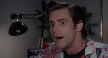 Movie still from “Ace Ventura: Pet Detective” (1994), directed by Tom Shadyac – A person with a surprised look on his face; Close Up shot, Low angle