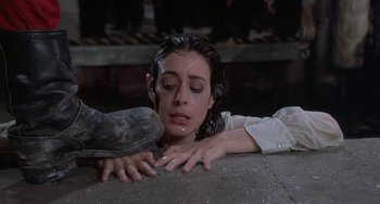 Movie still from “Ace Ventura: Pet Detective” (1994), directed by Tom Shadyac – A young woman with her head in her hands; Close Up shot, High angle