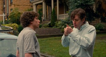 Movie still from “Adventureland” (2009), directed by Greg Mottola – Two people standing in front of each other; Medium shot, Over the shoulder angle