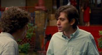 Movie still from “Adventureland” (2009), directed by Greg Mottola – A man talking to another man in front of a building; Close Up shot, Over the shoulder angle