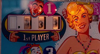 Movie still from “Adventureland” (2009), directed by Greg Mottola – A pinball machine's score board; Close Up shot, High angle