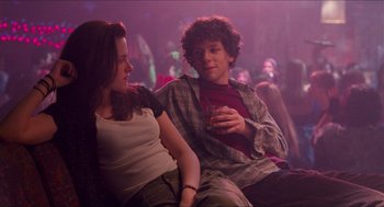 Movie still from “Adventureland” (2009), directed by Greg Mottola – A man and a woman sitting next to each other; Medium shot, Over the shoulder angle