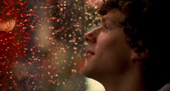Movie still from “Adventureland” (2009), directed by Greg Mottola – A person looking out of a window; Close Up shot, Low angle