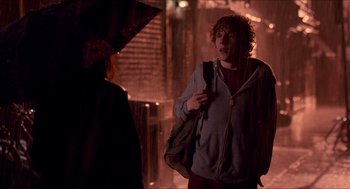 Movie still from “Adventureland” (2009), directed by Greg Mottola – A man with curly red hair standing next to a woman; Medium shot, Over the shoulder angle