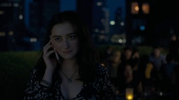 Movie still from “After the Wedding” (2019), directed by Bart Freundlich – A woman talking on a cell phone at night; Close Up shot, High angle