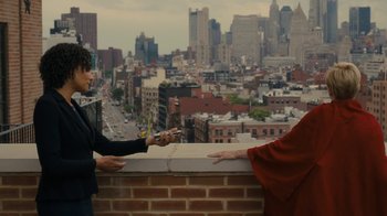 Movie still from “After the Wedding” (2019), directed by Bart Freundlich – Two people standing next to each other on a ledge; Medium shot, Over the shoulder angle