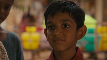 Movie still from “After the Wedding” (2019), directed by Bart Freundlich – A young boy's face; Close Up shot, Over the shoulder angle