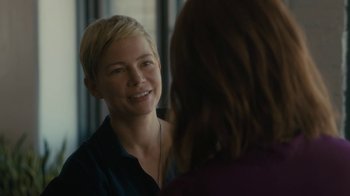 Movie still from “After the Wedding” (2019), directed by Bart Freundlich – A woman with short blonde hair is looking at a mirror; Close Up shot, Over the shoulder angle