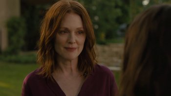 Movie still from “After the Wedding” (2019), directed by Bart Freundlich – A person with long red hair; Close Up shot, Over the shoulder angle