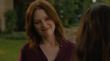 Movie still from “After the Wedding” (2019), directed by Bart Freundlich – A person with long red hair; Close Up shot, Over the shoulder angle