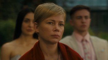 Movie still from “After the Wedding” (2019), directed by Bart Freundlich – A woman with short blonde hair wearing a red jacket; Close Up shot, Over the shoulder angle