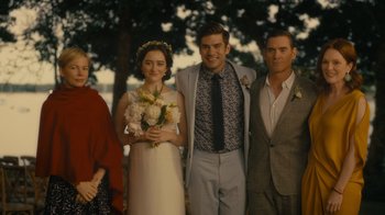 Movie still from “After the Wedding” (2019), directed by Bart Freundlich – A group of people standing next to each other holding flowers; Wide shot, Over the shoulder angle